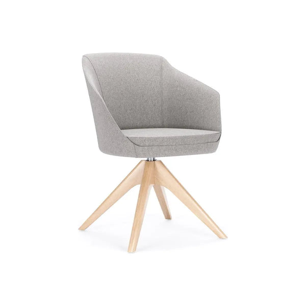Global Drift upholstered lounge chair with a wood four-leg base in a collaborative workplace setting