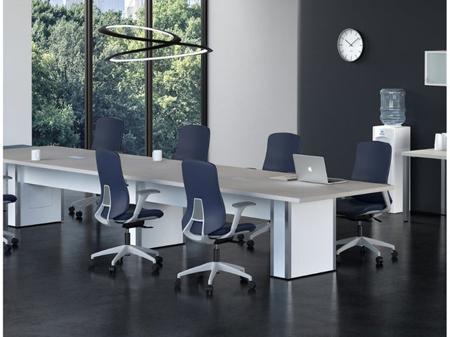 Newly furnished office with rows of desks and ergonomic task chairs